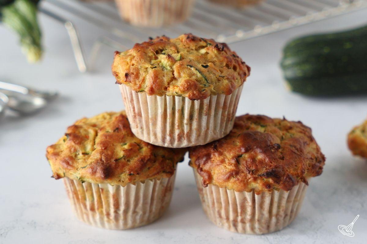 A small stack of Carrot cake zucchini muffins. 
