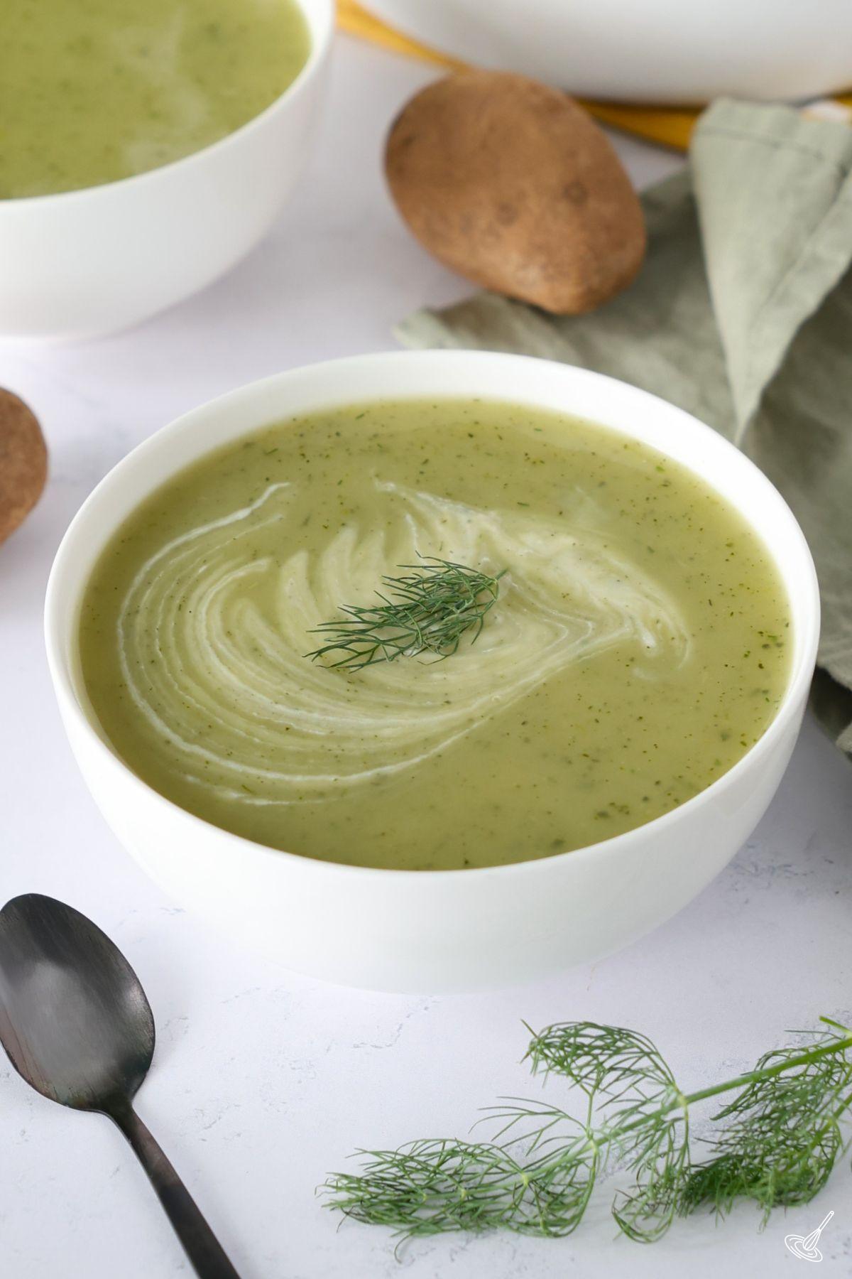 A bowl of Zucchini Dill Soup on the table. 