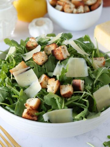 Arugula Caesar Salad in a bowl.