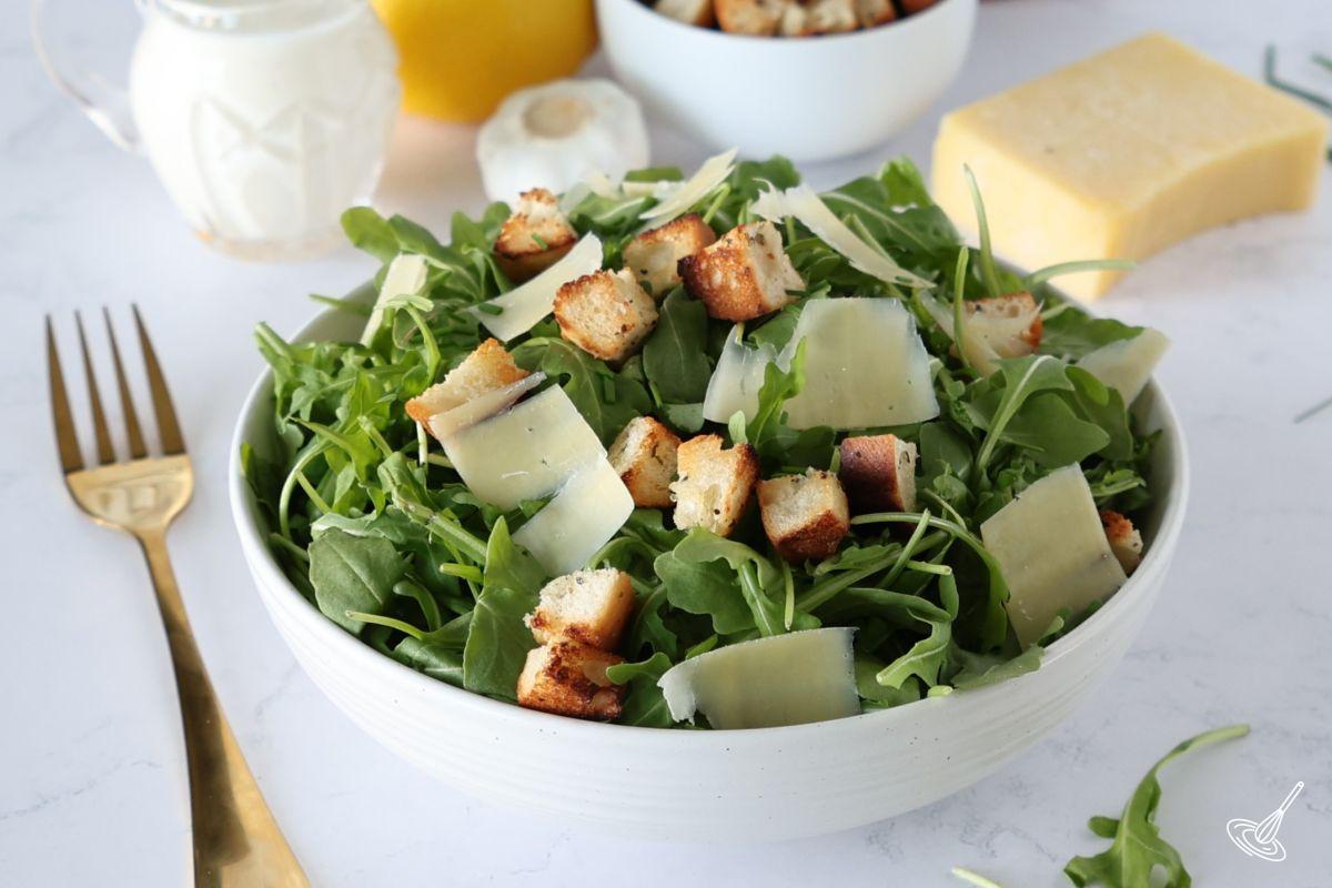 Arugula Caesar Salad in a serving bowl. 