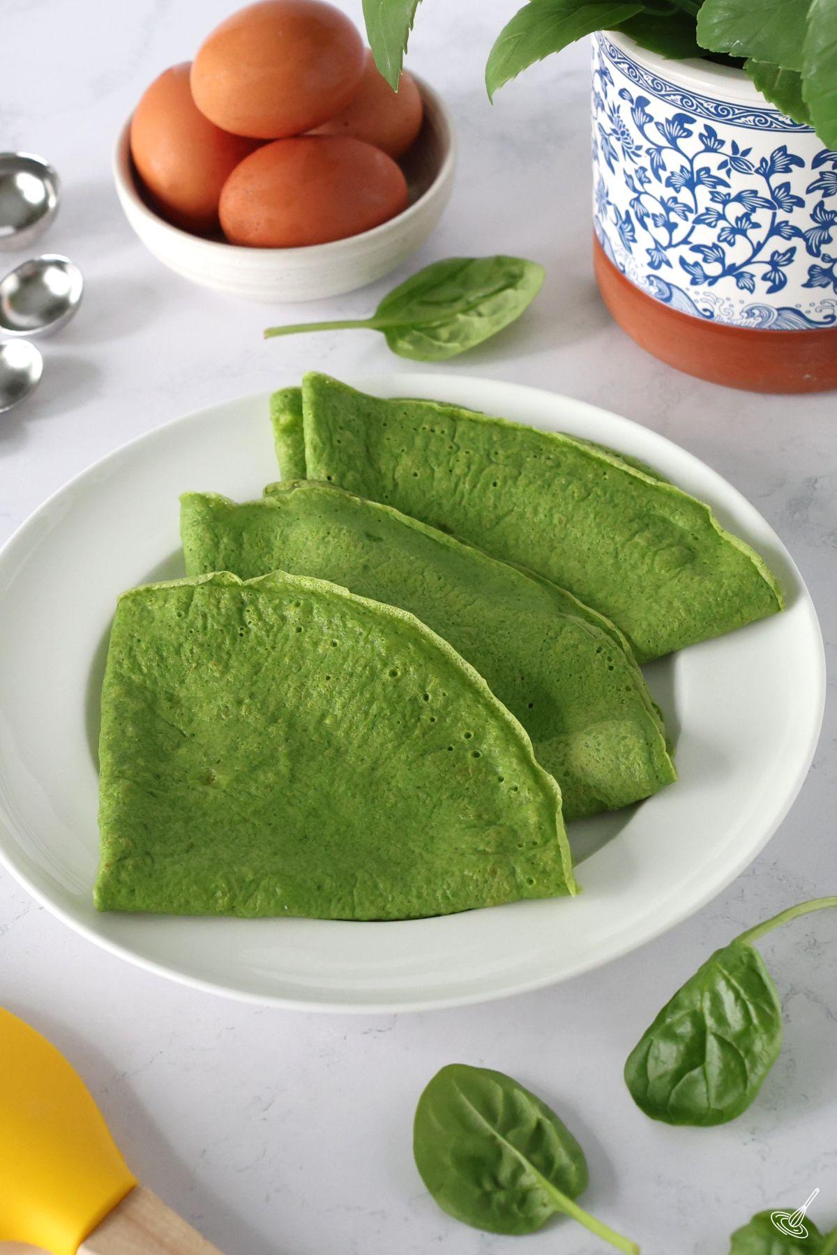 Spinach crepes recipe on a plate. 