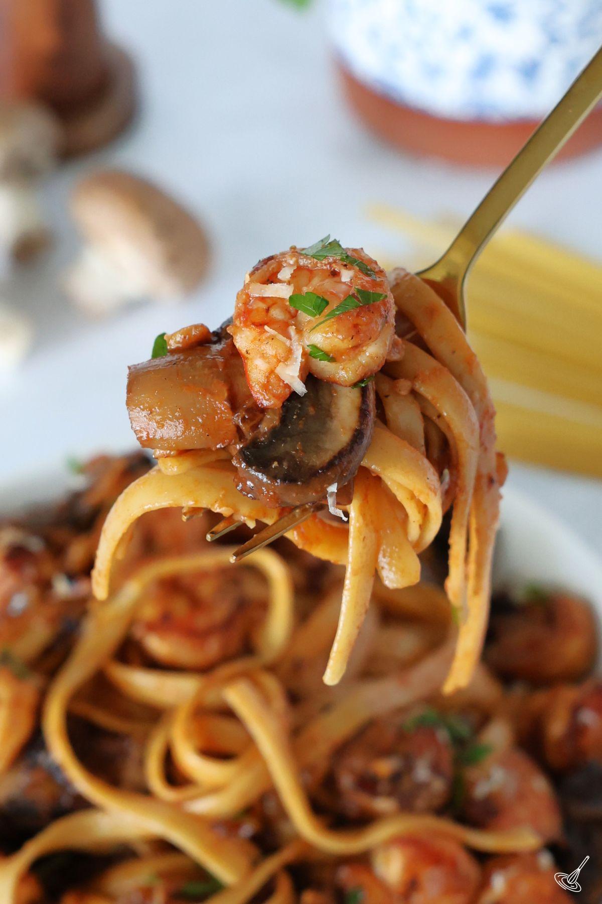 Shrimp Mushroom Pasta on a fork.