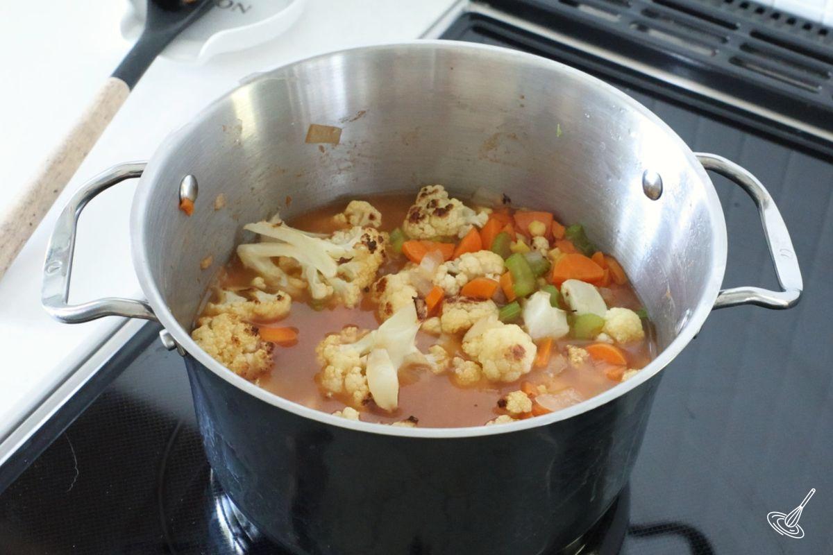 A soup pot of cauliflower bisque soup.