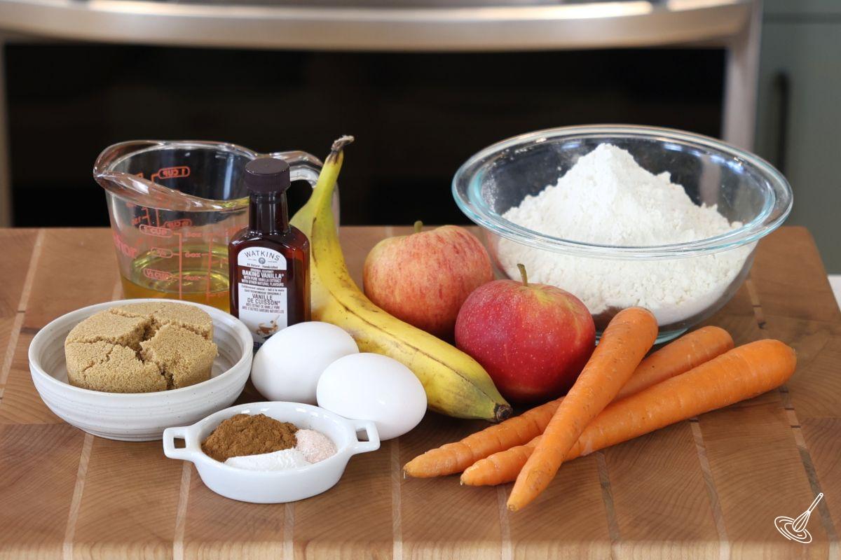 Ingredients on a wooden cutting board to make ABC Muffins.