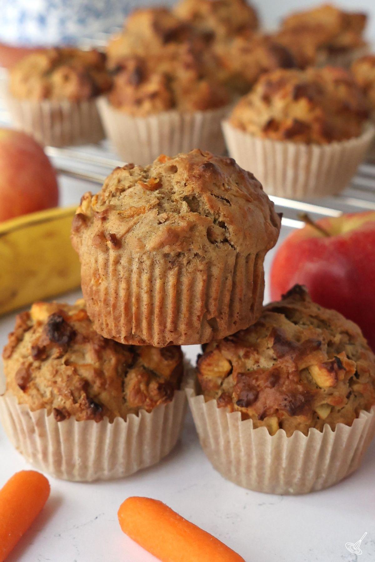 ABC Muffins stacked up on the countner.