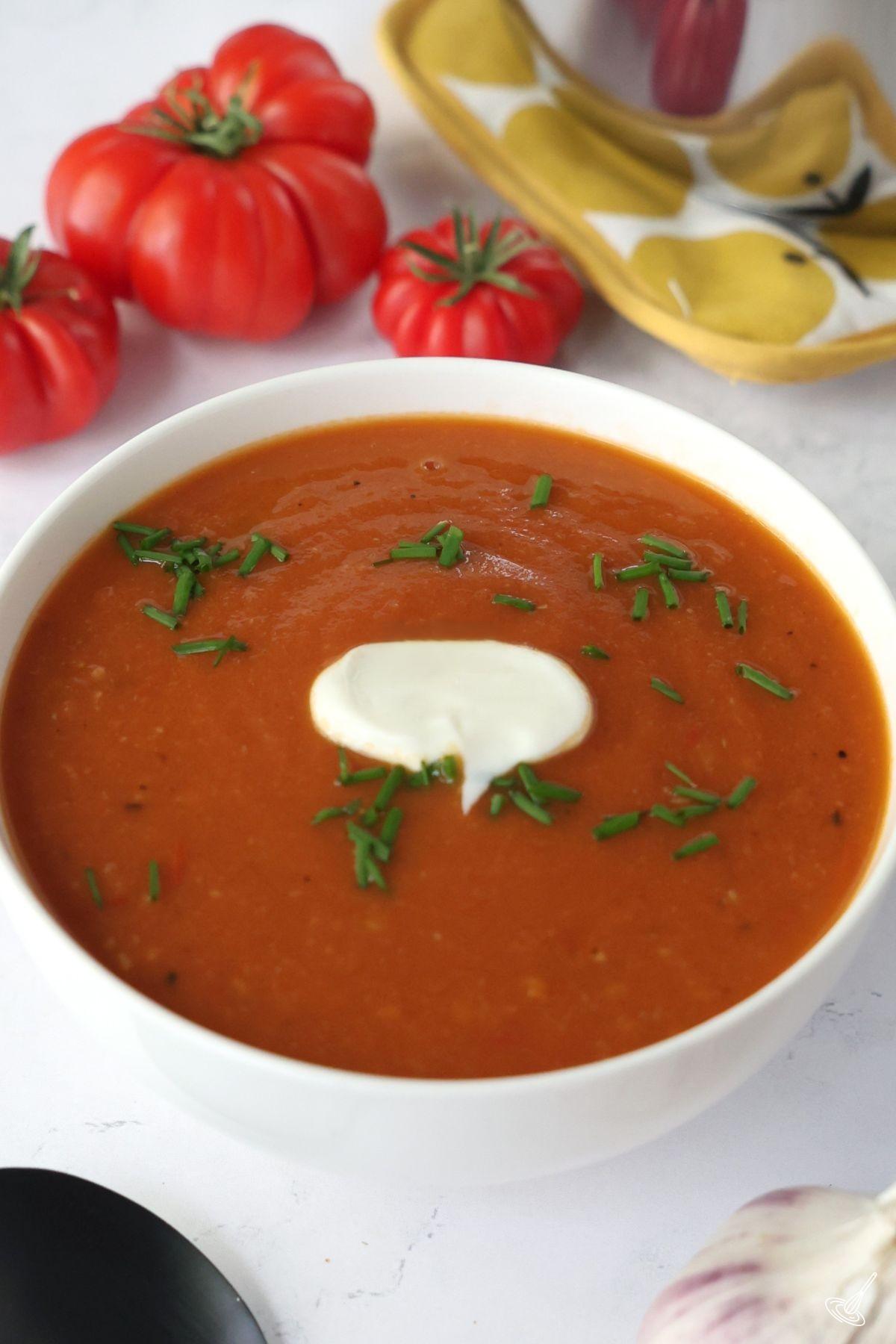 Roasted Tomato and Garlic Soup in a white bowl.