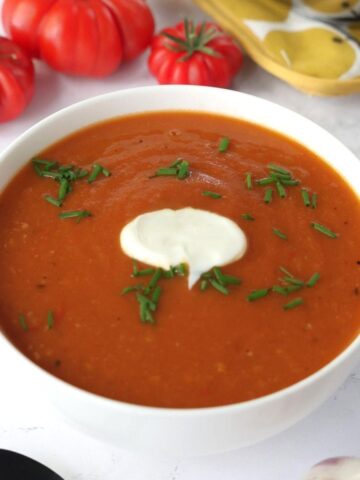 Roasted Tomato and Garlic Soup in a white bowl.