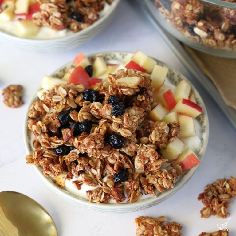 Blueberry Flax Granola in a bowl with yogurt.
