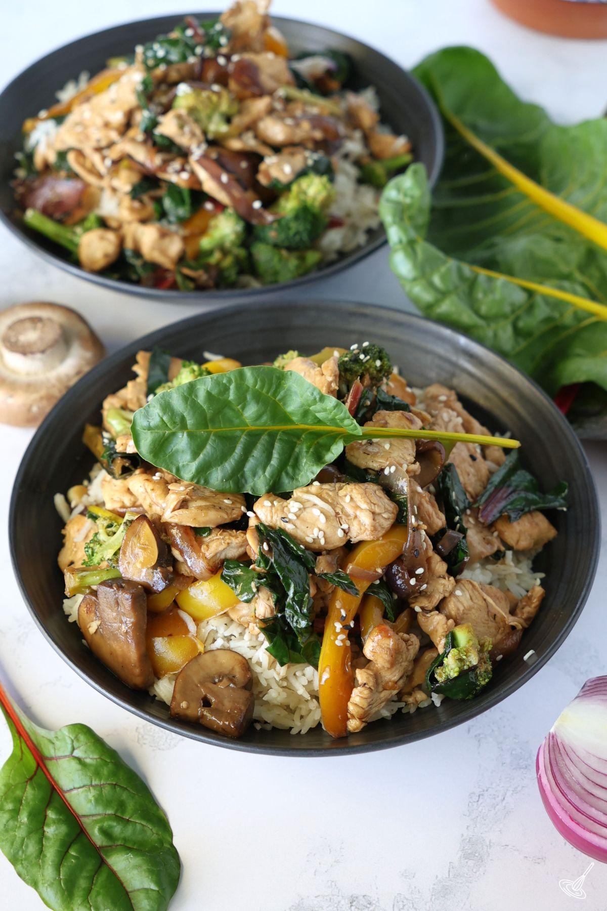 Chicken Stir Fry with Swiss Chard in a bowl over rice.