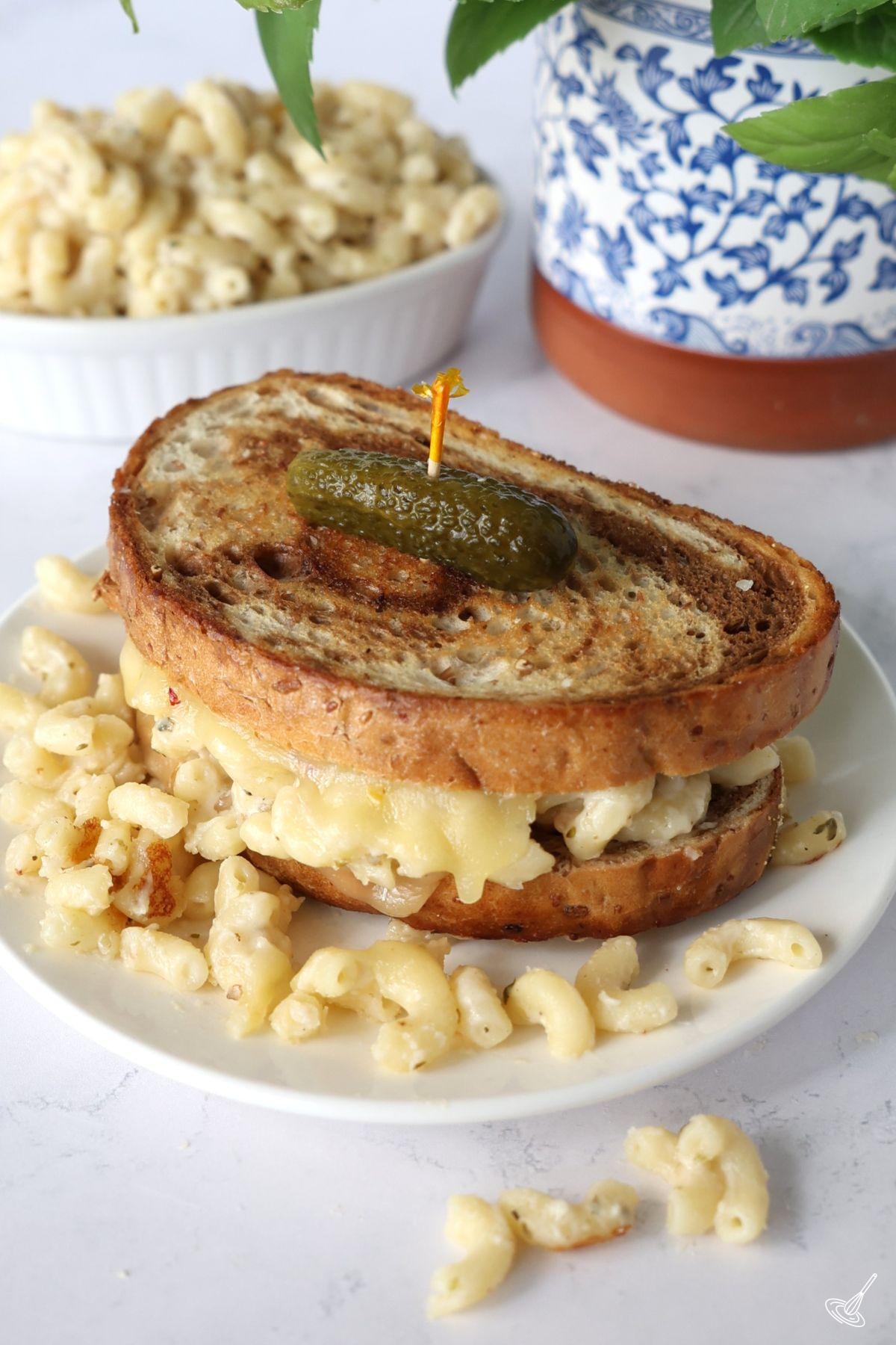 Mac n cheese grilled cheese on a plate. 