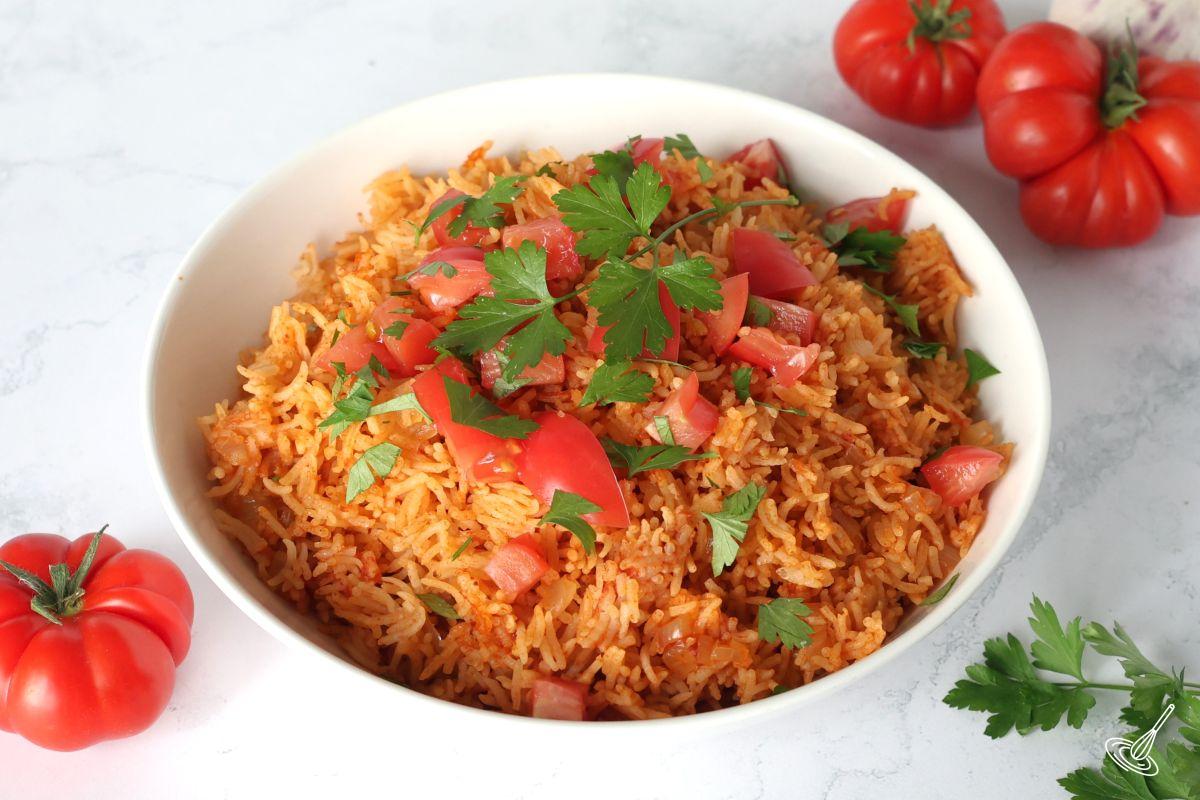 A serving bowl of Rice Cooker Mexican Rice.