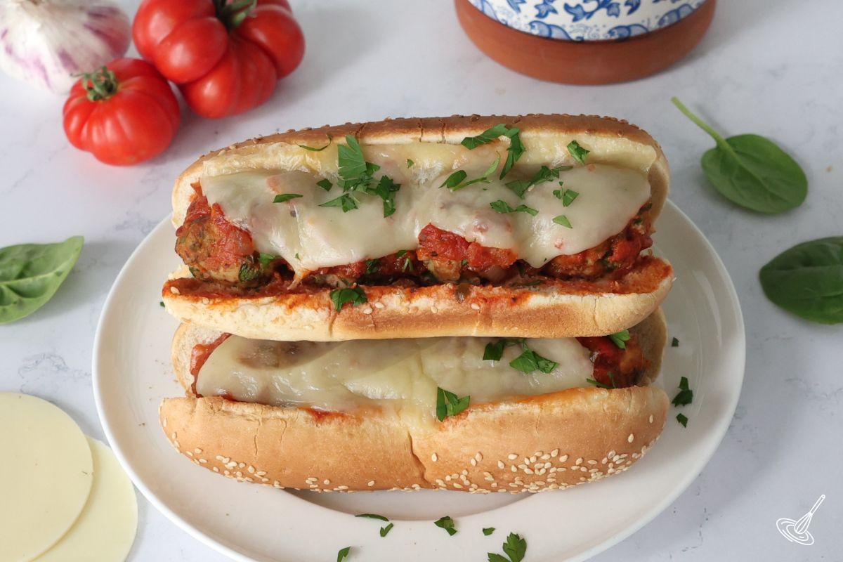 A plate of stacked turkey florentine meatball subs.