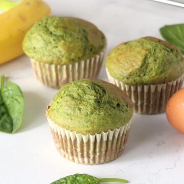 Spinach Banana Muffins on the counter.