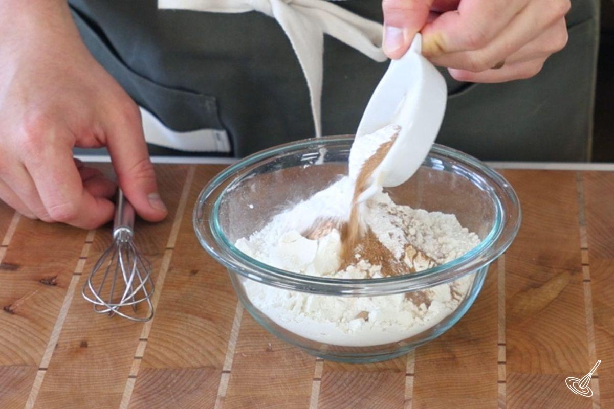 Someone mixing together dry ingredients for the muffins.