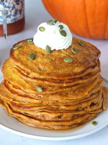 Pumpkin Greek Yogurt Pancakes on a plate.
