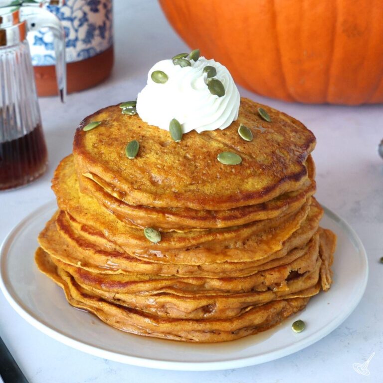 Pumpkin Greek Yogurt Pancakes on a plate.