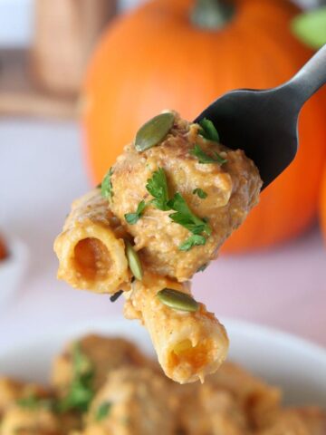 A fork holding Pumpkin Turkey Meatball pasta.