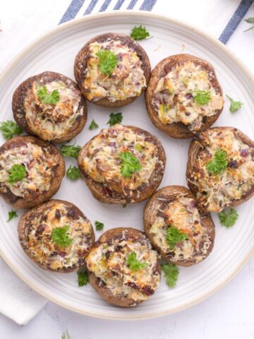 Holiday Stuffed Mushrooms on a plate.