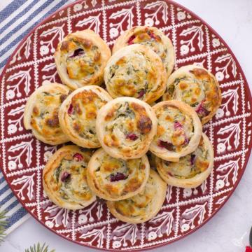 Spinach and Artichoke Pinwheels on a plate.