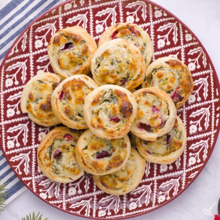 Spinach and Artichoke Pinwheels on a plate.