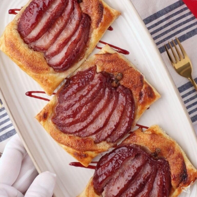poached pear pastry tarts on a plate