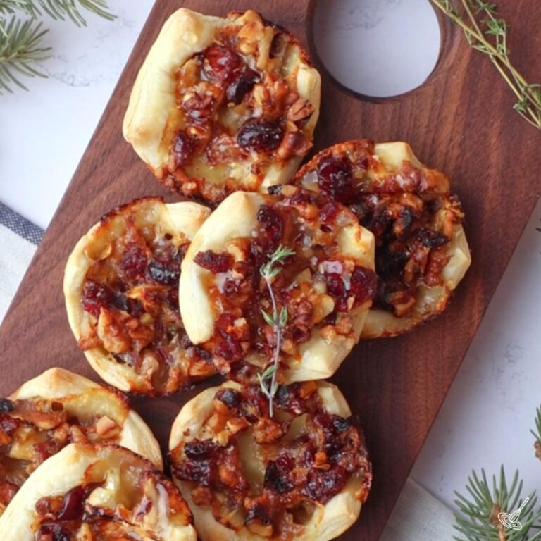 Brie and Walnut Honey Tarts on a tray.