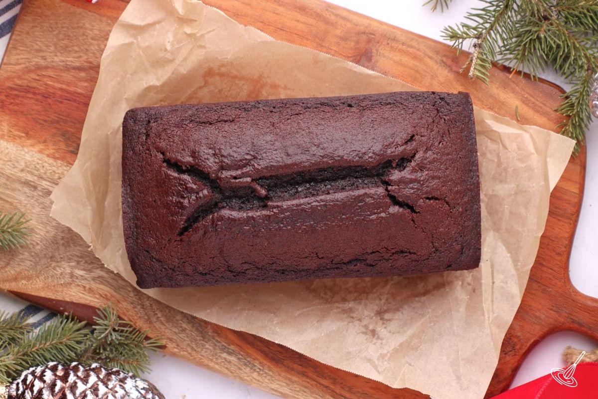 A chocolate orange loaf on a cutting board.