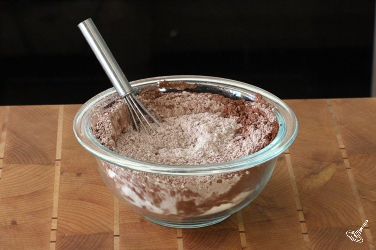 A bowl of flour mixture to make biscotti.
