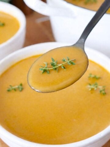 A spoonful of butternut squash and sweet potato soup