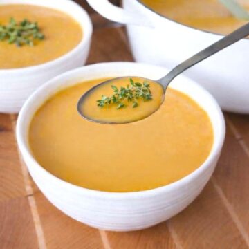 A bowl of butternut squash and sweet potato soup.