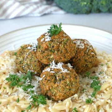 Broccoli meatballs on top of lemon orzo.