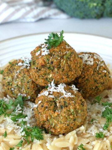 Broccoli meatballs on top of lemon orzo.