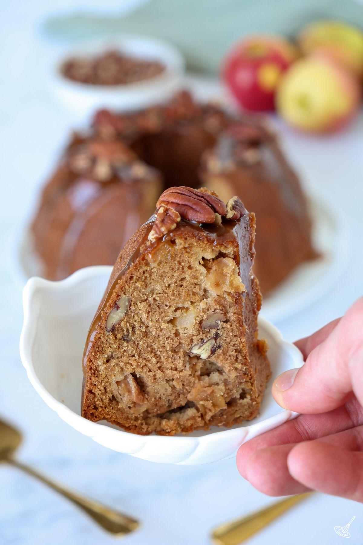 A slice of Apple Pecan Cake with Caramel Glaze.