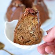 A slice of Apple Pecan Cake with Caramel Glaze.