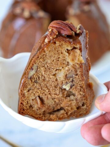 A slice of Apple Pecan Cake with Caramel Glaze.