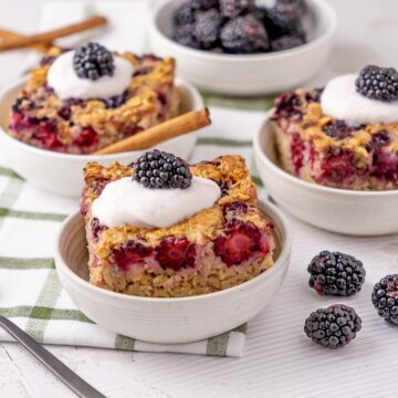 Pieces of Baked Blackberry Oatmeal served in dishes.