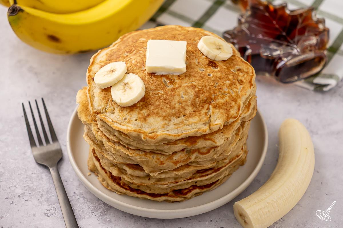 A stack of Banana Greek Yogurt Pancakes on a plate.