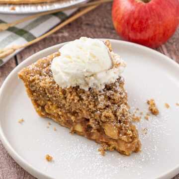 a slice of easy freezer apple pie on a plate.