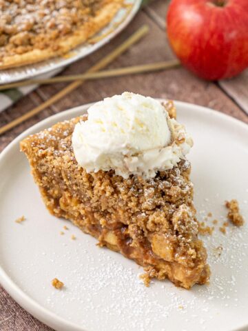 A slice of easy freezer apple pie on a plate.