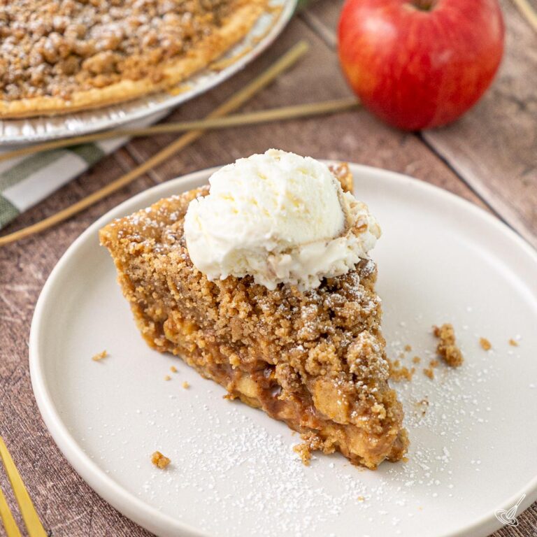 A slice of easy freezer apple pie on a plate.