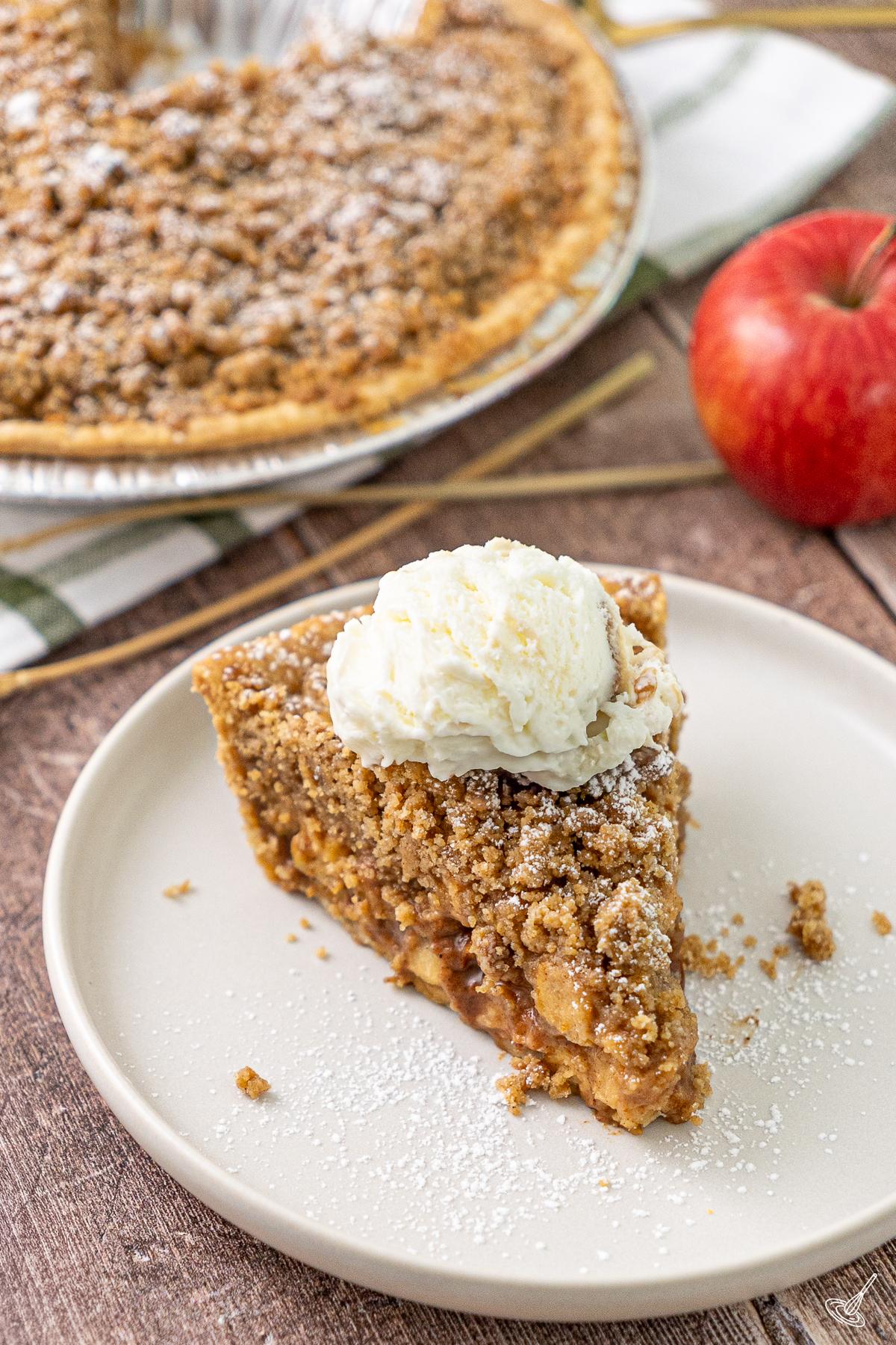 A slice of easy freezer apple pie on a plate.