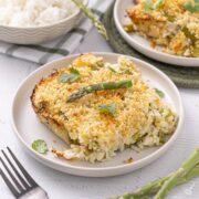 A piece of Asparagus Lemon Rice Casserole on a plate.