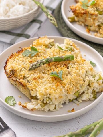 A piece of Asparagus Lemon Rice Casserole on a plate.
