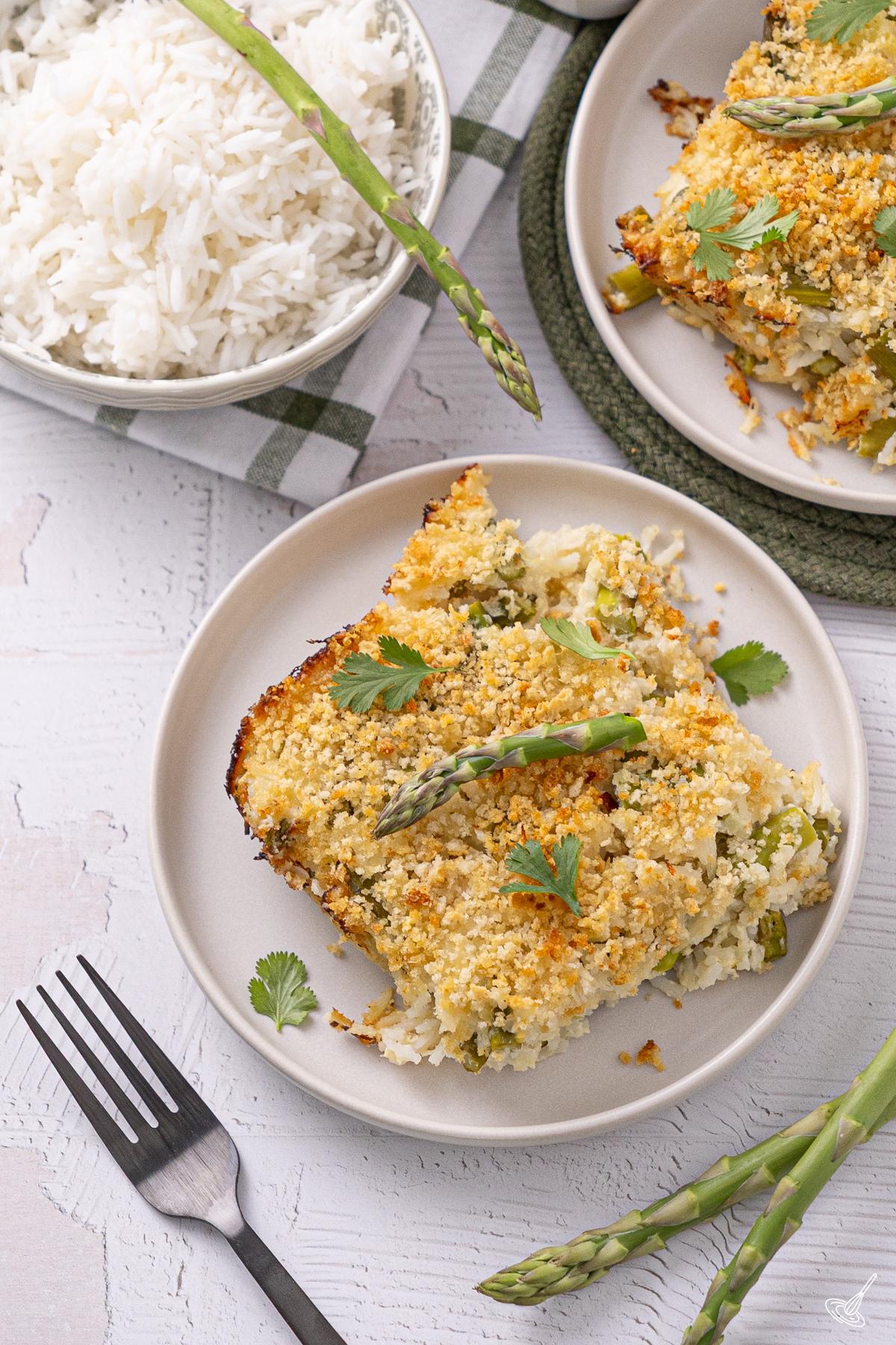 A portion of Asparagus Lemon Rice Casserole on a plate.