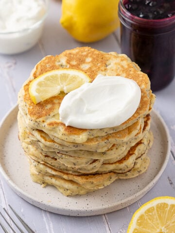 Lemon Poppy Seed Cottage Cheese Pancakes on a plate.