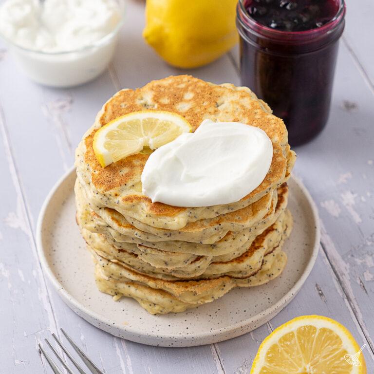 Lemon Poppy Seed Cottage Cheese Pancakes on a plate.