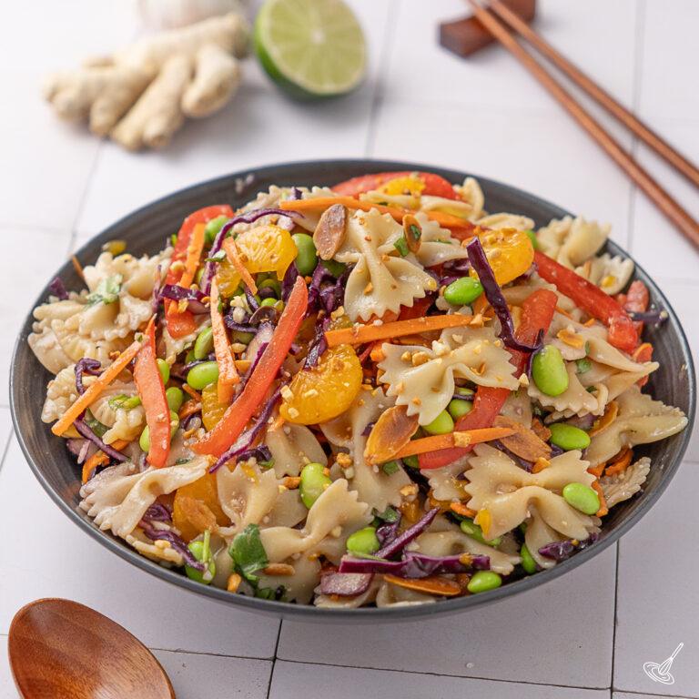 Asian Pasta salad with miso dressing in a serving bowl.
