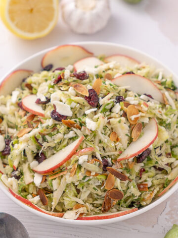 Shaved Brussels Sprout Salad in a serving bowl.