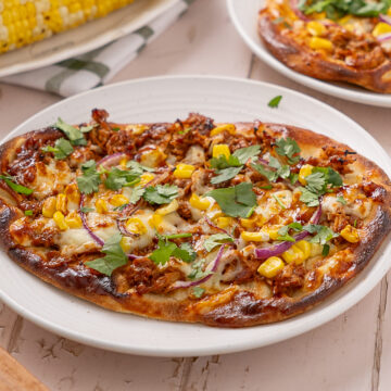 BBQ turkey flatbread on a plate.