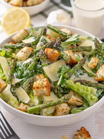 Grilled Asparagus Caesar Salad in a serving bowl.